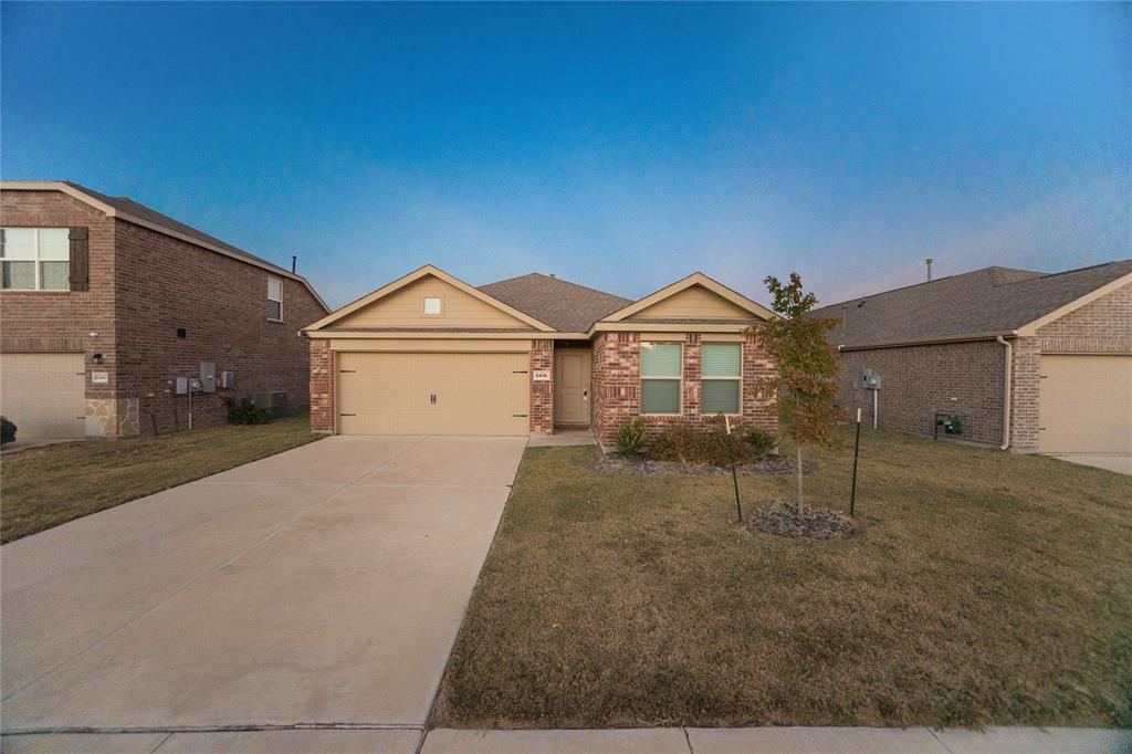 6436 Auburn Dl Road Pilot Point, TX 76258 - Photo 21 of 22 a front view of a house with a yard and garage