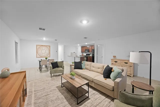 a living room with furniture and a couch