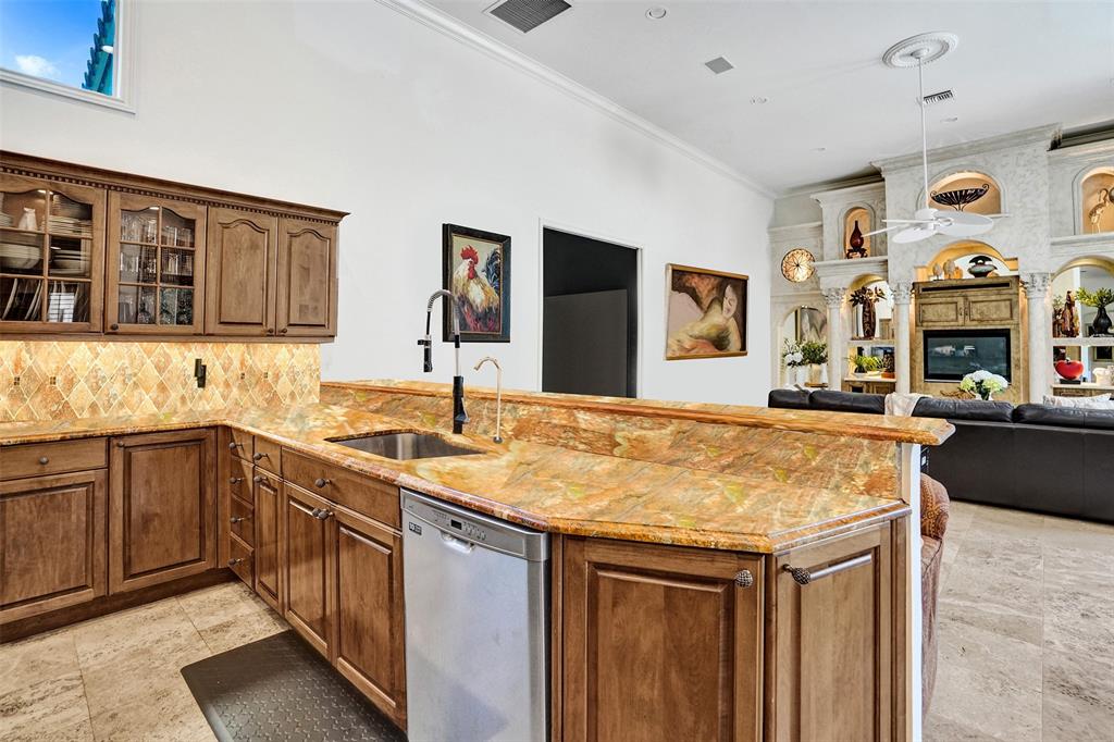 11720 Northwest 9th Street Plantation, FL 33325 - Photo 12 of 39 a kitchen with stainless steel appliances granite countertop a sink and cabinets