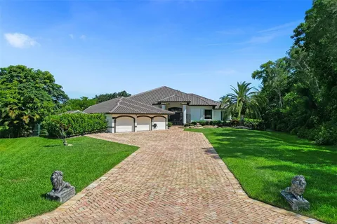 a front view of a house with yard