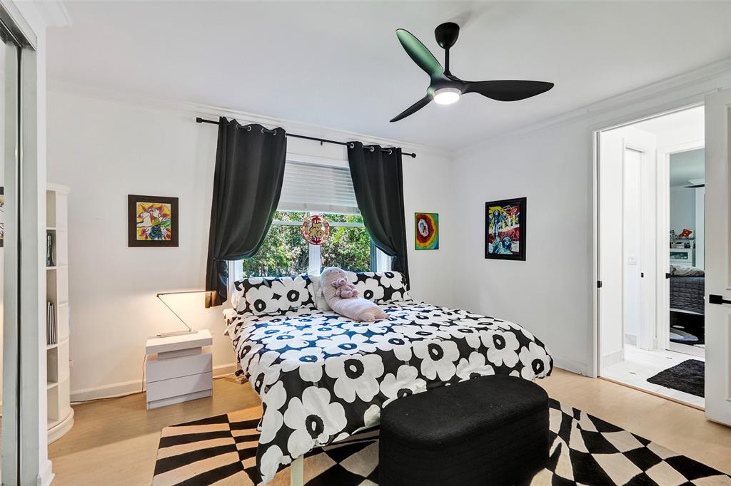 11720 Northwest 9th Street Plantation, FL 33325 - Photo 26 of 39 a bedroom with a bed and a window