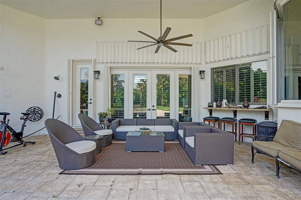 11720 Northwest 9th Street Plantation, FL 33325 - Photo 32 of 39 a living room with furniture windows and a chandelier