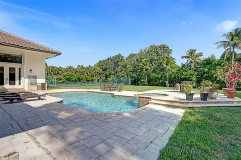 a view of a swimming pool with a patio