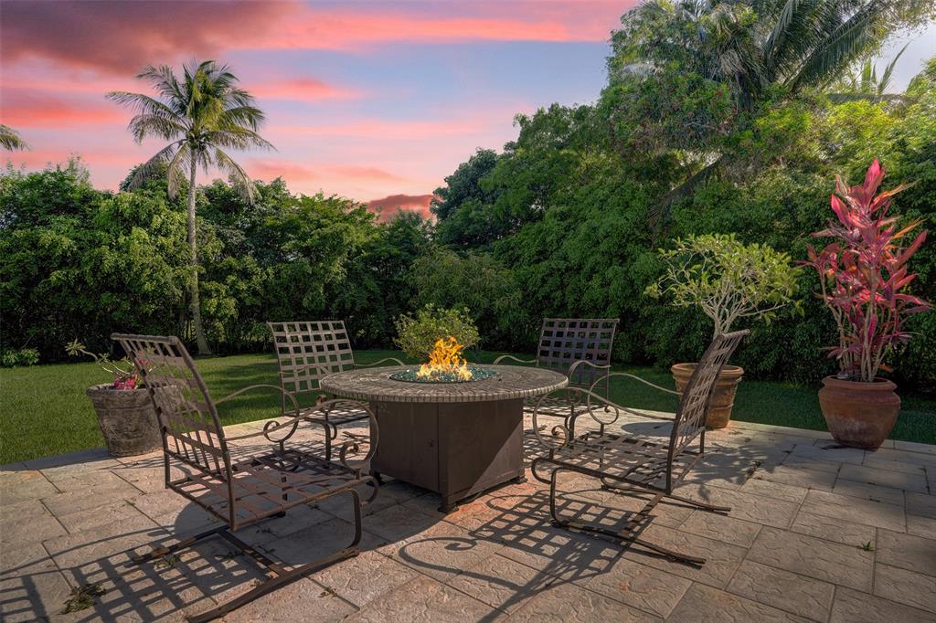 11720 Northwest 9th Street Plantation, FL 33325 - Photo 38 of 39 a view of a chair and table in the garden