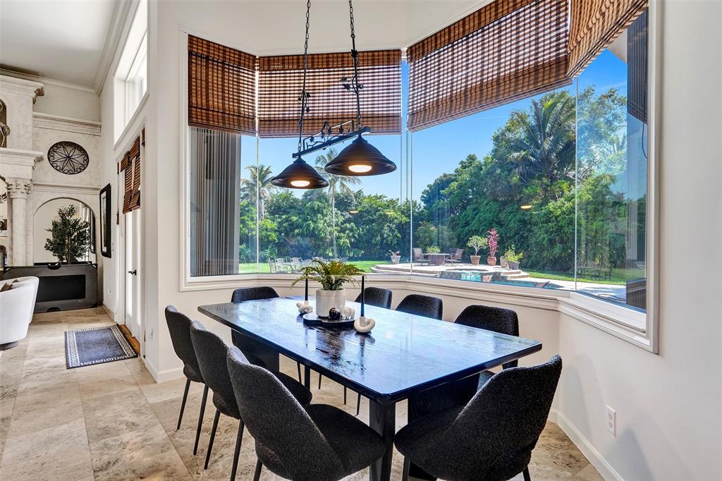 11720 Northwest 9th Street Plantation, FL 33325 - Photo 10 of 39 a view of a dining table and chairs in patio