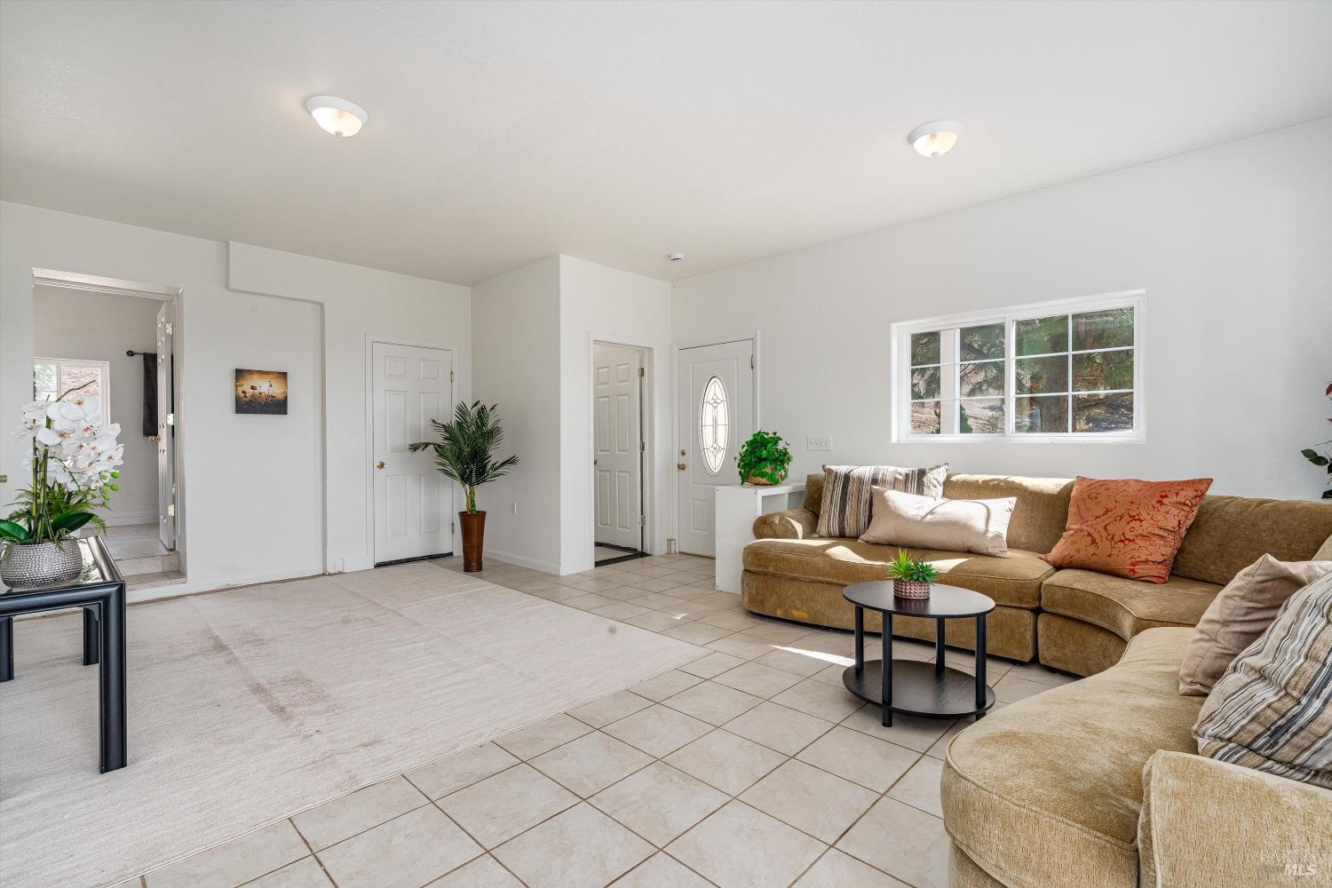 6001 Lichau Road Penngrove, CA 94951 - Photo 36 of 86 a living room with furniture and wooden floor