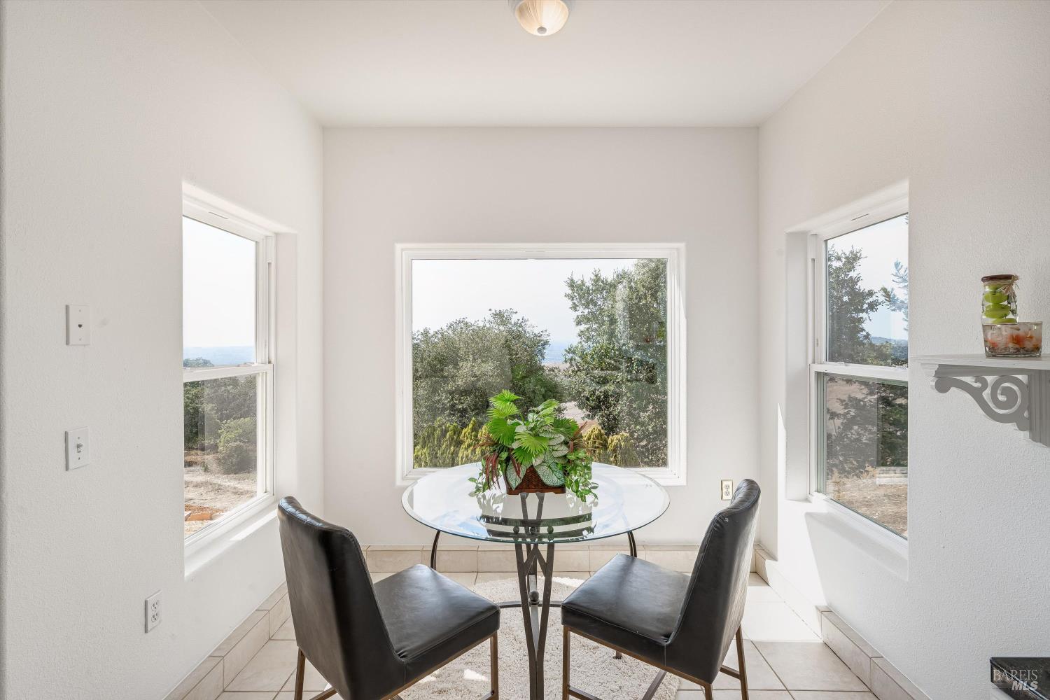 6001 Lichau Road Penngrove, CA 94951 - Photo 41 of 86 a view of a dining room with furniture window and wooden floor