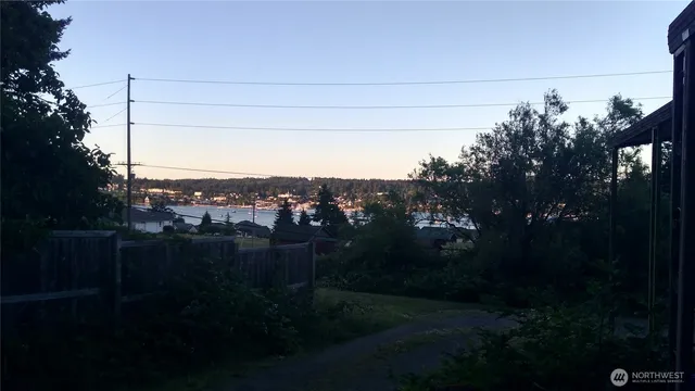 a view of balcony and yard