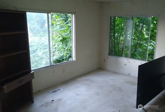 a view of an empty room with a window