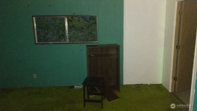 a view of a chair and table in a room