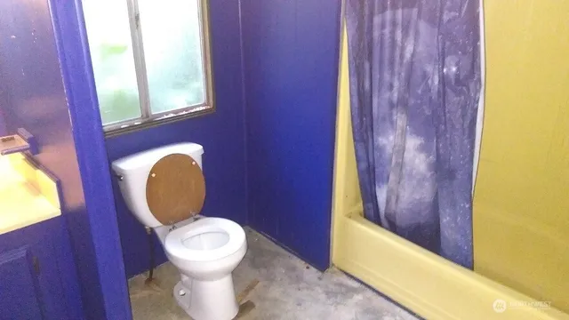 a bathroom with a toilet and a sink