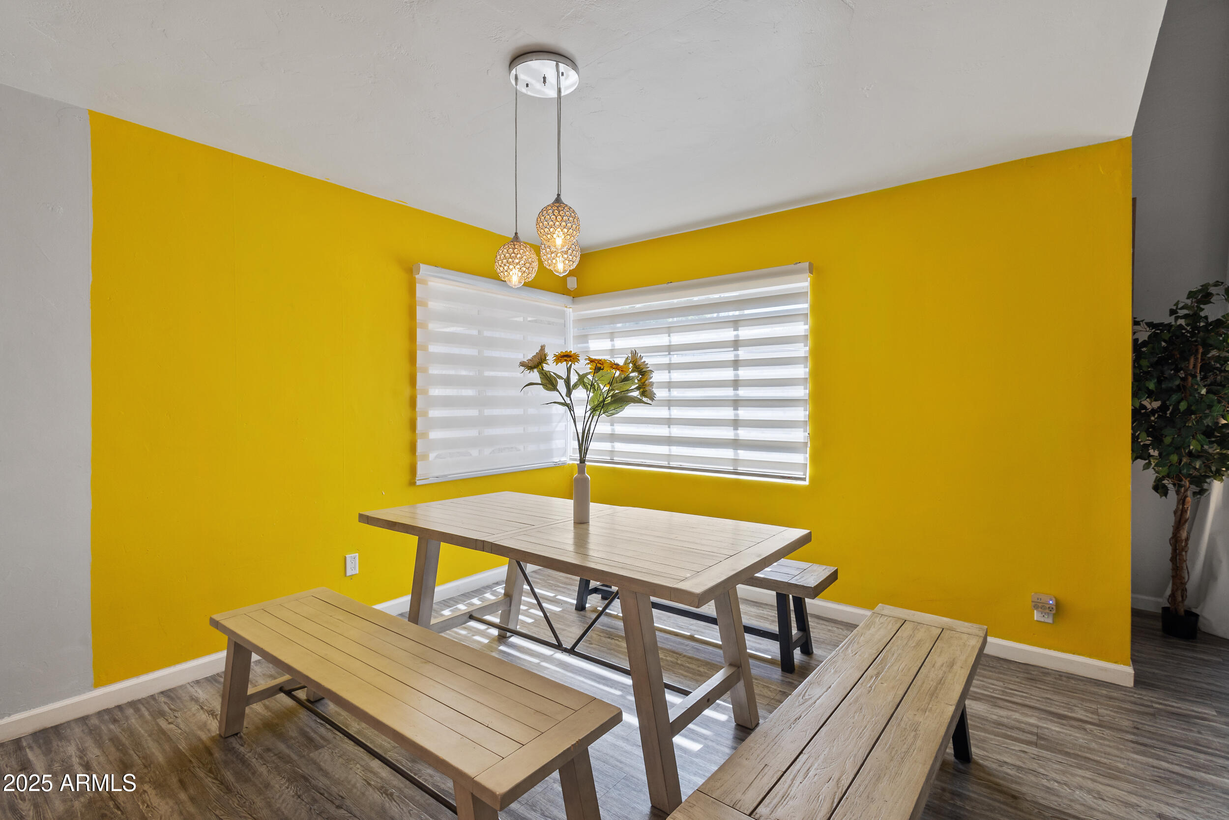 4536 North 18th Drive Phoenix, AZ 85015 - Photo 13 of 29 a view of a dining room with furniture and chandelier