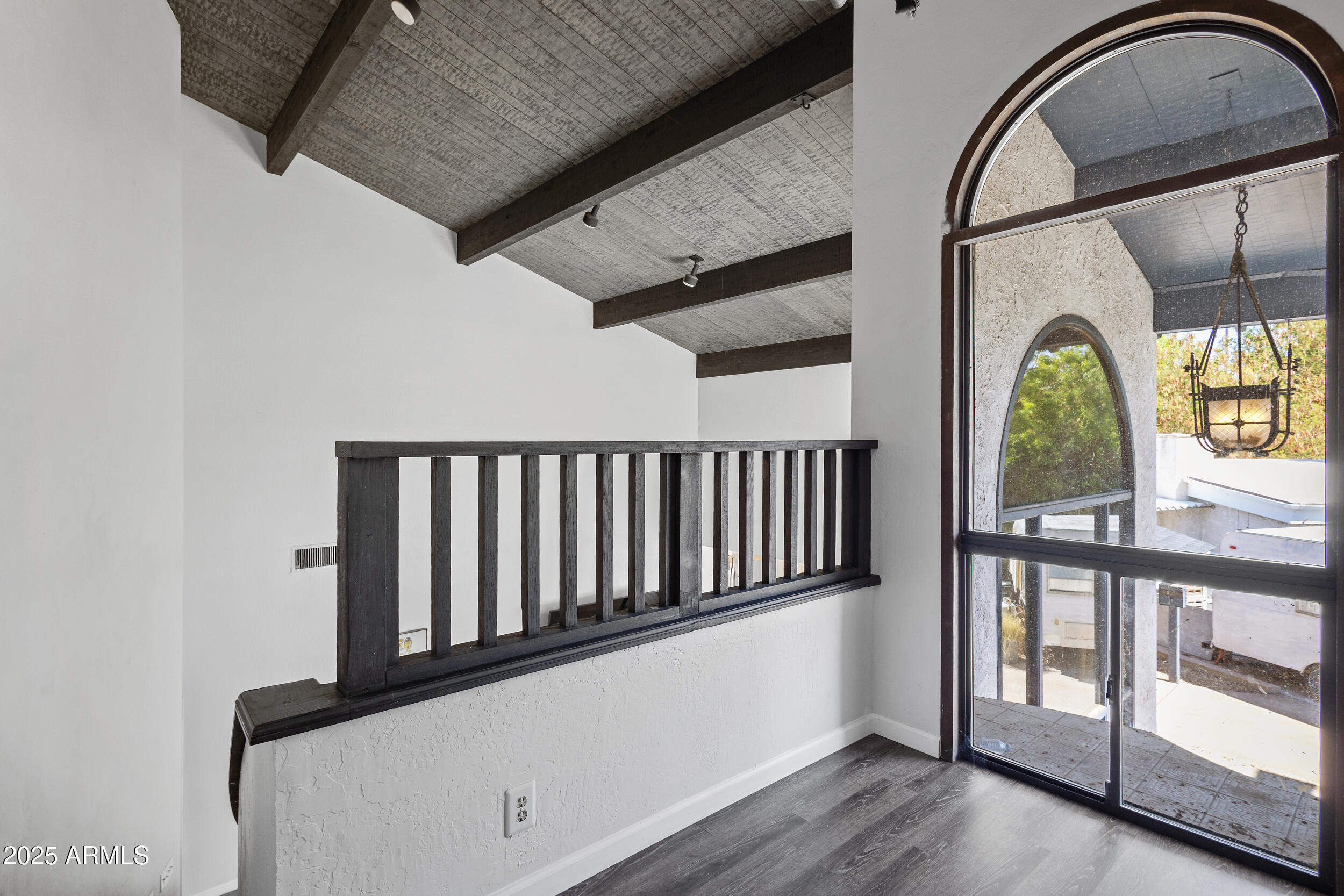 4536 North 18th Drive Phoenix, AZ 85015 - Photo 16 of 29 a view of staircase with railing and a potted plant