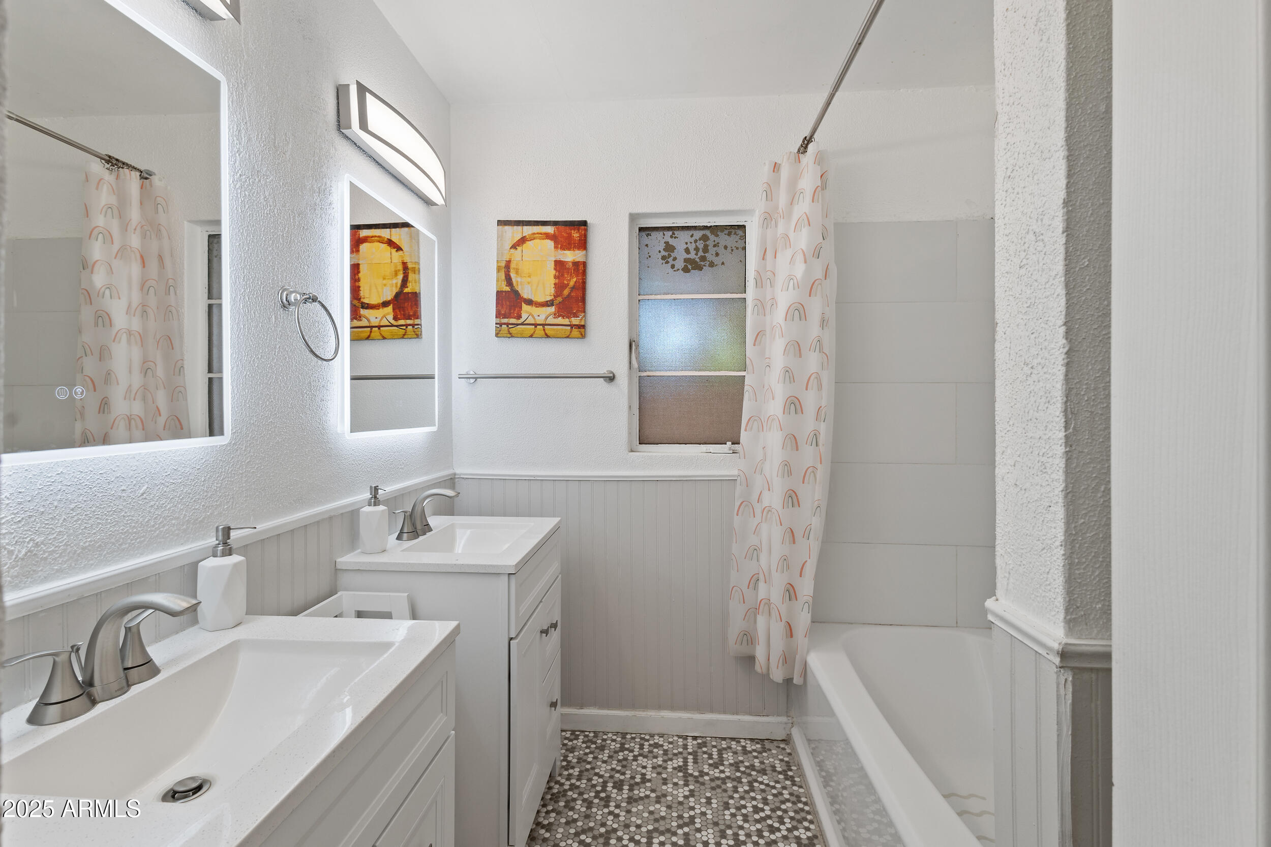 4536 North 18th Drive Phoenix, AZ 85015 - Photo 18 of 29 a bathroom with a sink and a mirror