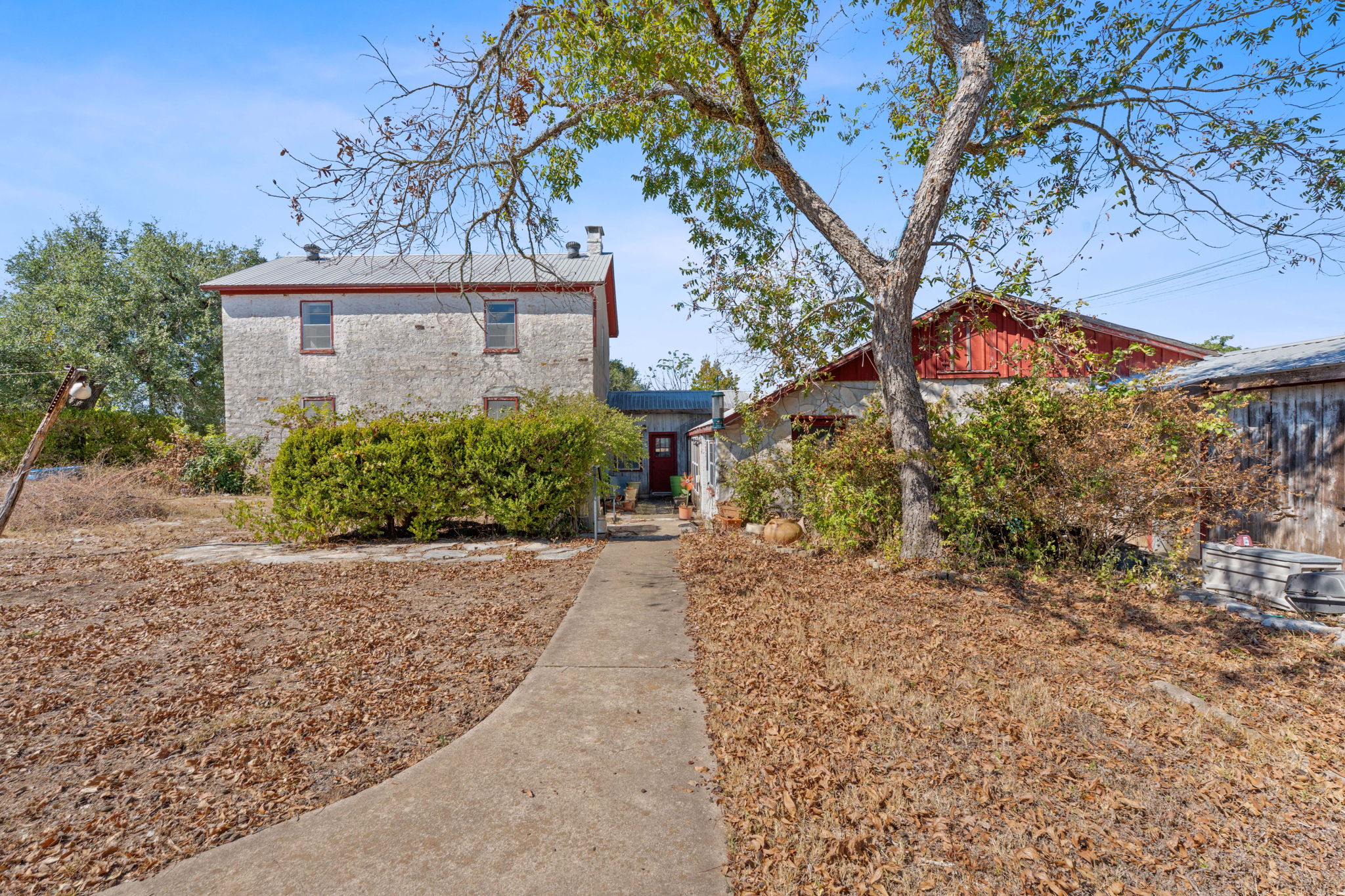 a view of a house with a tree