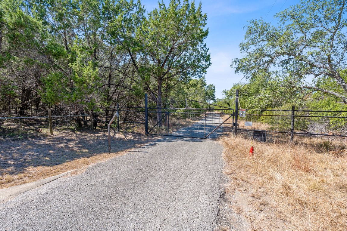8409 Appaloosa Run Austin, TX 78737 - Photo 16 of 40 a view of yard with wooden fence