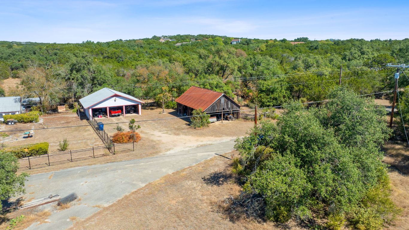 8409 Appaloosa Run Austin, TX 78737 - Photo 24 of 40 a view of house with outdoor space and trees