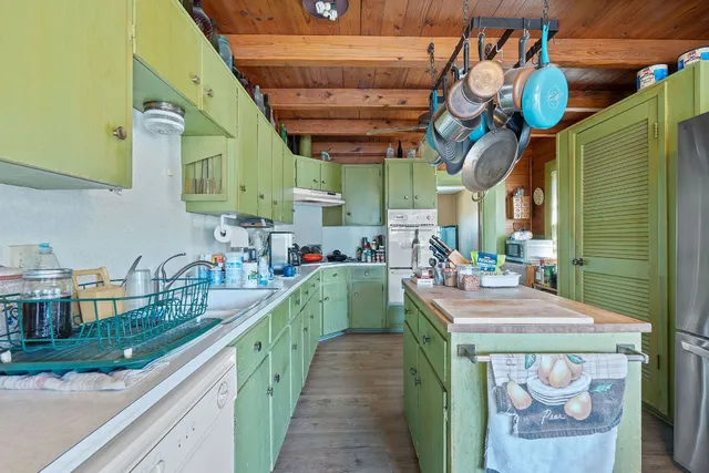 a view of a kitchen with furniture and a kitchen