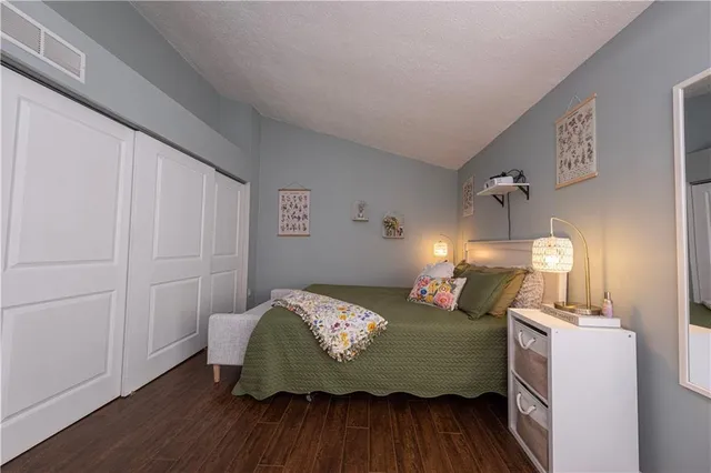 a bedroom with furniture and a window