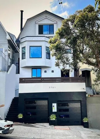 a front view of a house with garage
