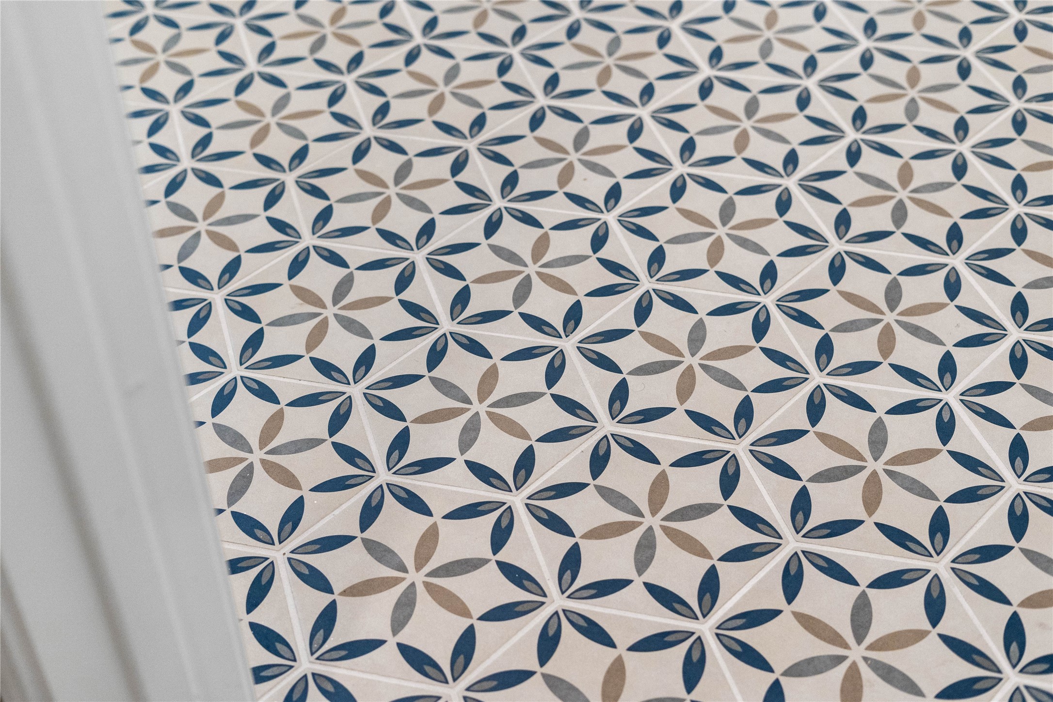 17020 Sweet Iris Court Conroe, TX 77302 - Photo 29 of 50 The laundry room tile serves as a stylish and highly functional foundation for a modern laundry room.