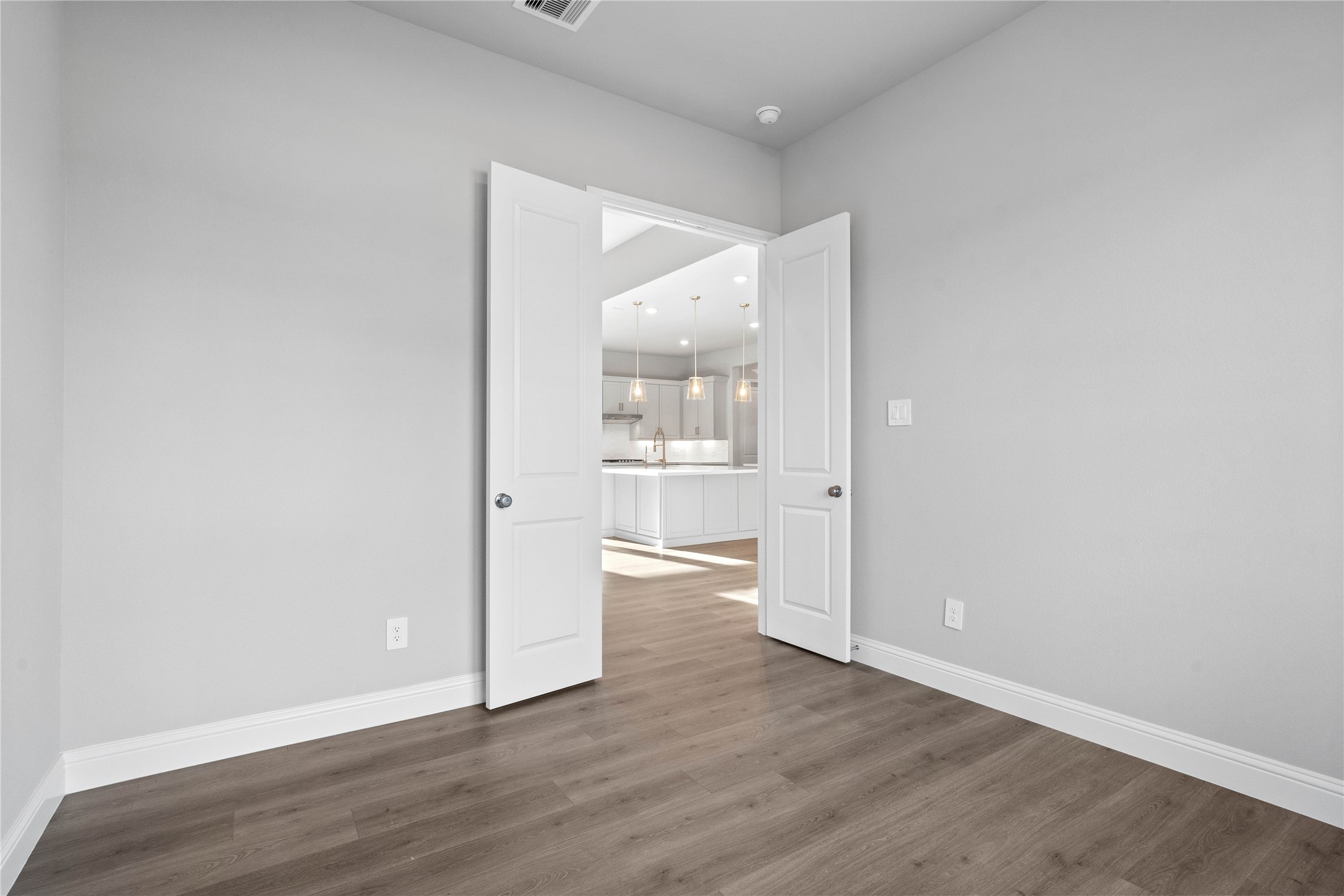 17020 Sweet Iris Court Conroe, TX 77302 - Photo 31 of 50 Additional view from the study into the Great Room - highlighting the double door for added privacy.