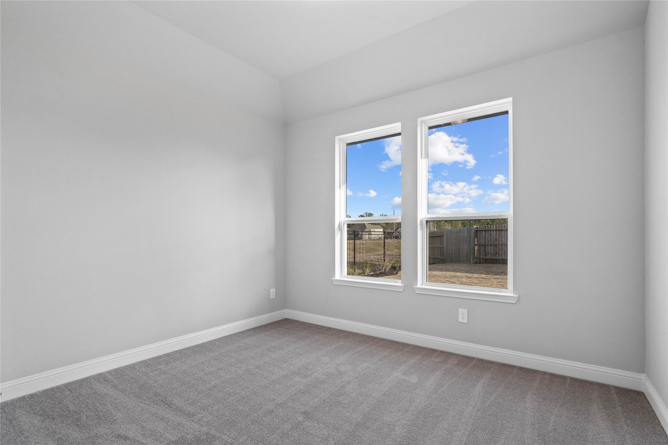 17020 Sweet Iris Court Conroe, TX 77302 - Photo 34 of 50 This guest suite, which offers a bright layout with neutral finishes and natural light. Featuring plush carpeting, large windows, and an en-suite secondary bathroom.