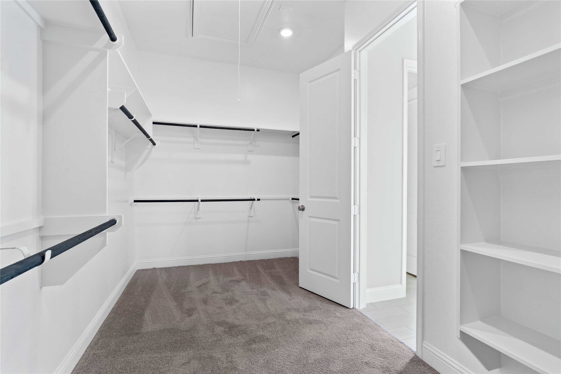 17020 Sweet Iris Court Conroe, TX 77302 - Photo 41 of 50 Look at this immaculate closet! With high shelving, multiple rows to hang clothing, you are sure to have enough room for all your belongings!