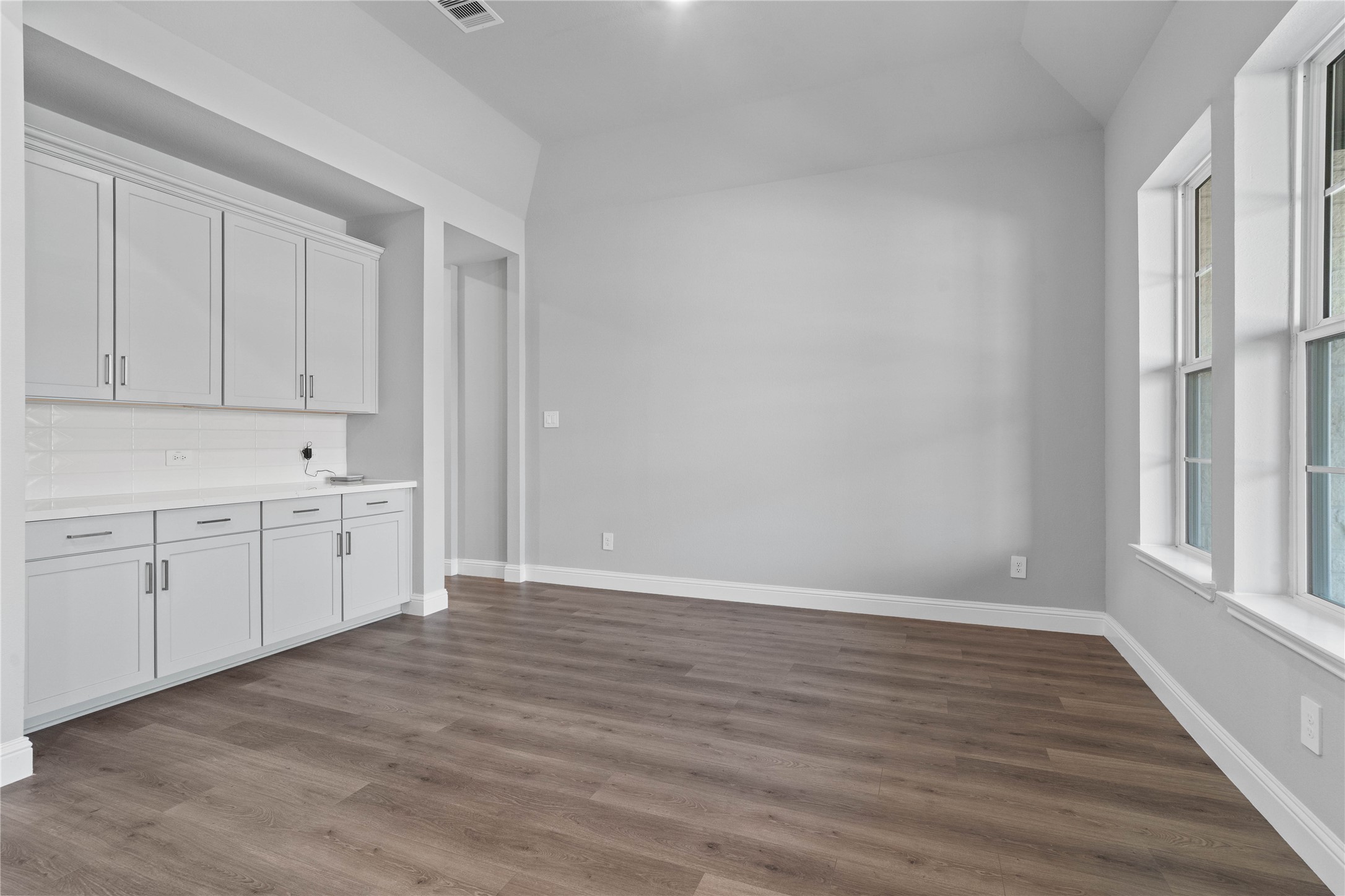 17020 Sweet Iris Court Conroe, TX 77302 - Photo 10 of 50 This elegant formal dining space is anchored by a sophisticated neutral palette and features a seamless transition to a fully equipped butler’s pantry, making it as functional for hosting large dinner parties as it is for intimate family gatherings.