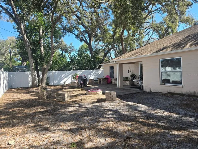 a view of a outdoor space with a patio and a garden