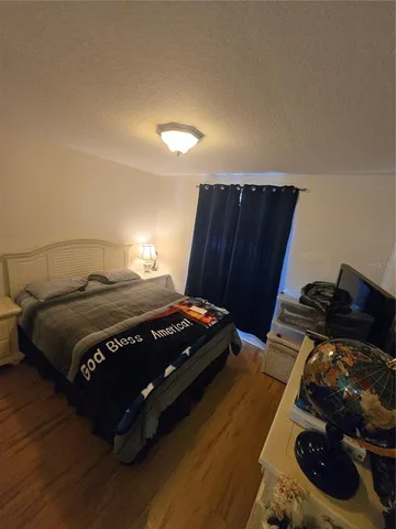 a bedroom with a bed and a closet