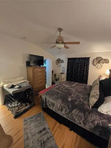 a bedroom with a bed and a dresser