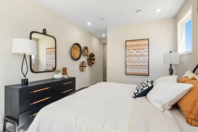 a living room with furniture gym equipment and a flat screen tv