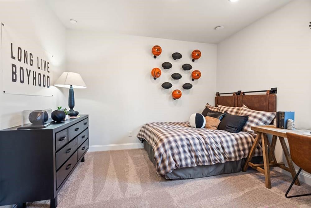 300 Meacham Court Dacula, GA 30019 - Photo 48 of 61 a bedroom with a bed and wooden floor