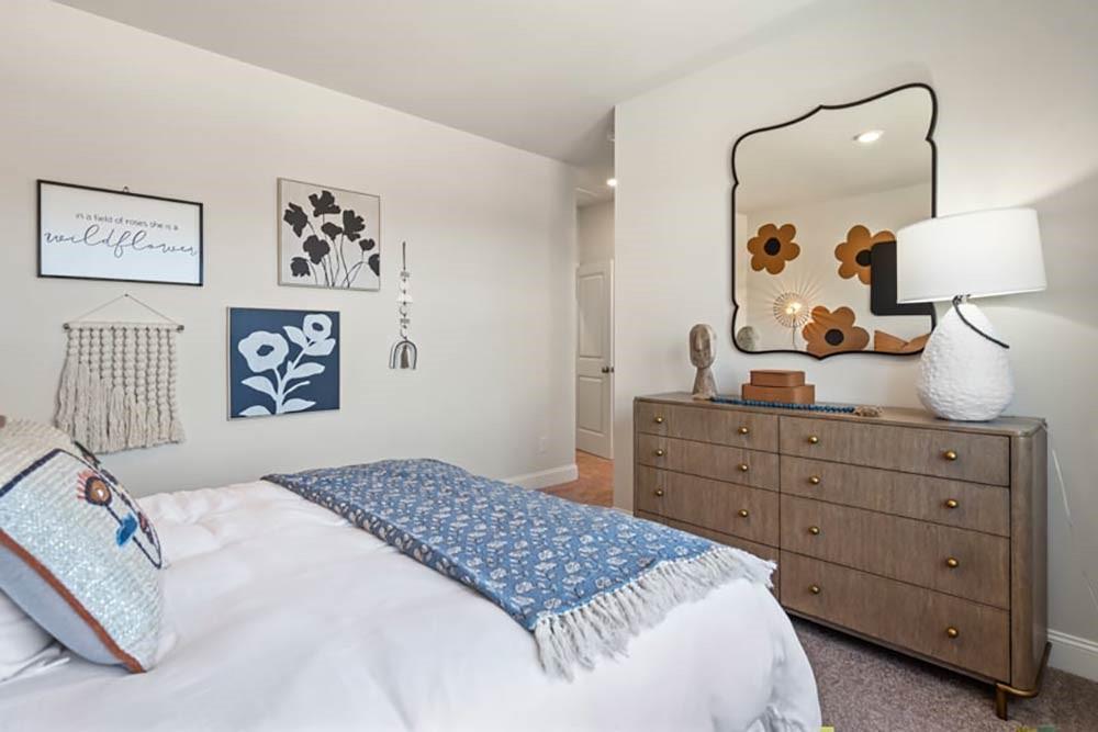 300 Meacham Court Dacula, GA 30019 - Photo 51 of 61 a bedroom with a large bed and a dresser