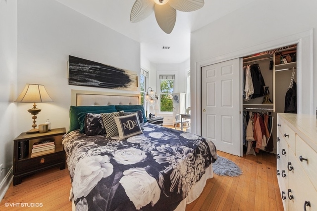 1049 West Altgeld Street, Unit 3A Chicago, IL 60614 - Photo 11 of 18 a bedroom with a bed and a television