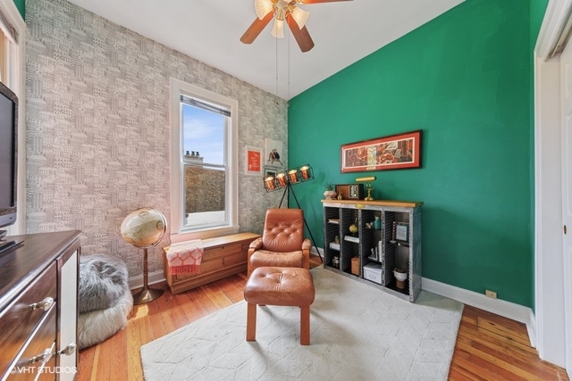 1049 West Altgeld Street, Unit 3A Chicago, IL 60614 - Photo 14 of 18 a living room with furniture and a flat screen tv