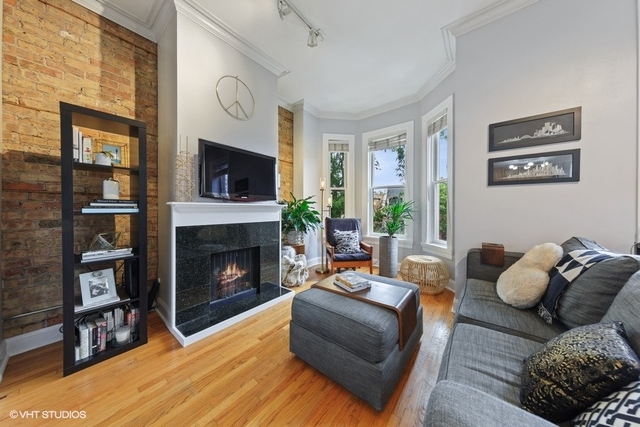 1049 West Altgeld Street, Unit 3A Chicago, IL 60614 - Photo 3 of 18 a living room with furniture and a fireplace