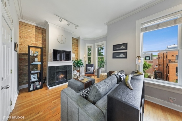 1049 West Altgeld Street, Unit 3A Chicago, IL 60614 - Photo 4 of 18 a living room with furniture and a fireplace