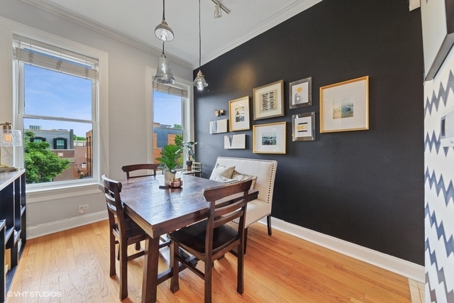 1049 West Altgeld Street, Unit 3A Chicago, IL 60614 - Photo 10 of 18 a view of a dining room with furniture window and wooden floor