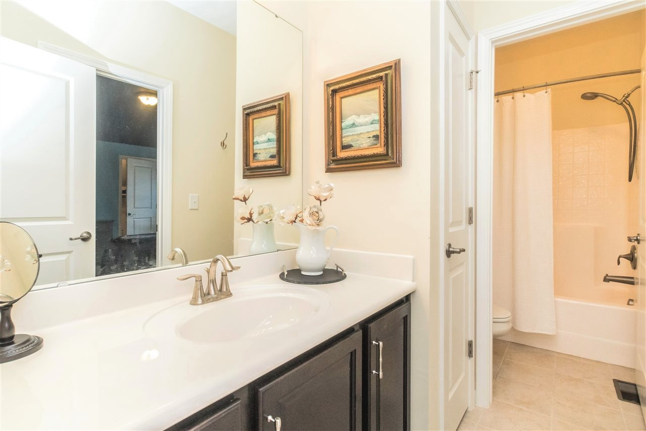 1407 Rodessa Run Raleigh, NC 27607 - Photo 18 of 30 Jack and Jill Bath with Tile & Linen Closet