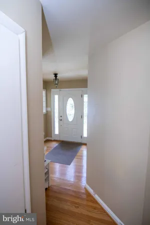 a view of an entryway with wooden floor