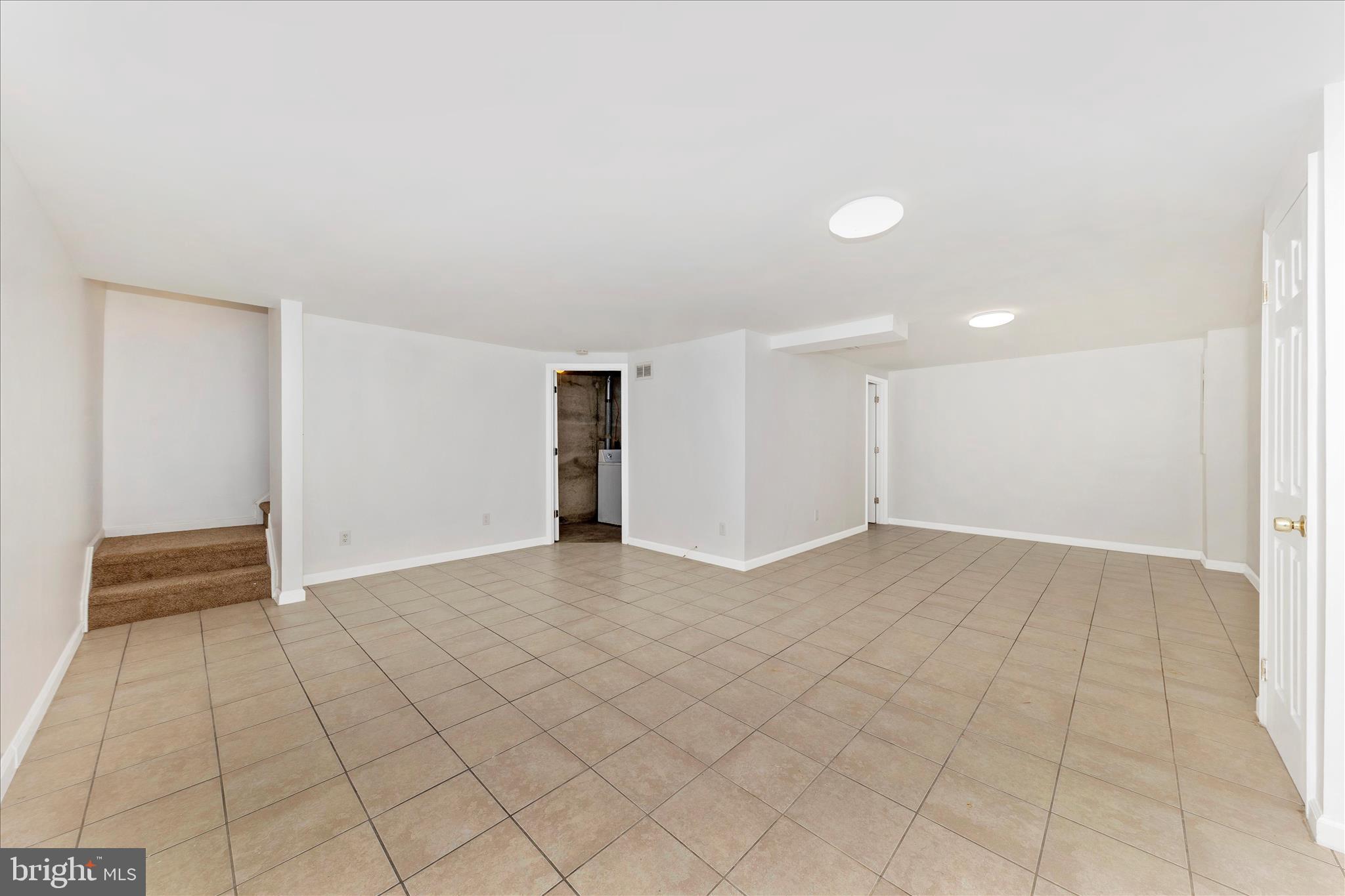 9989 Ridgeline Drive Montgomery Village, MD 20886 - Photo 21 of 26 a view of an empty room with a window