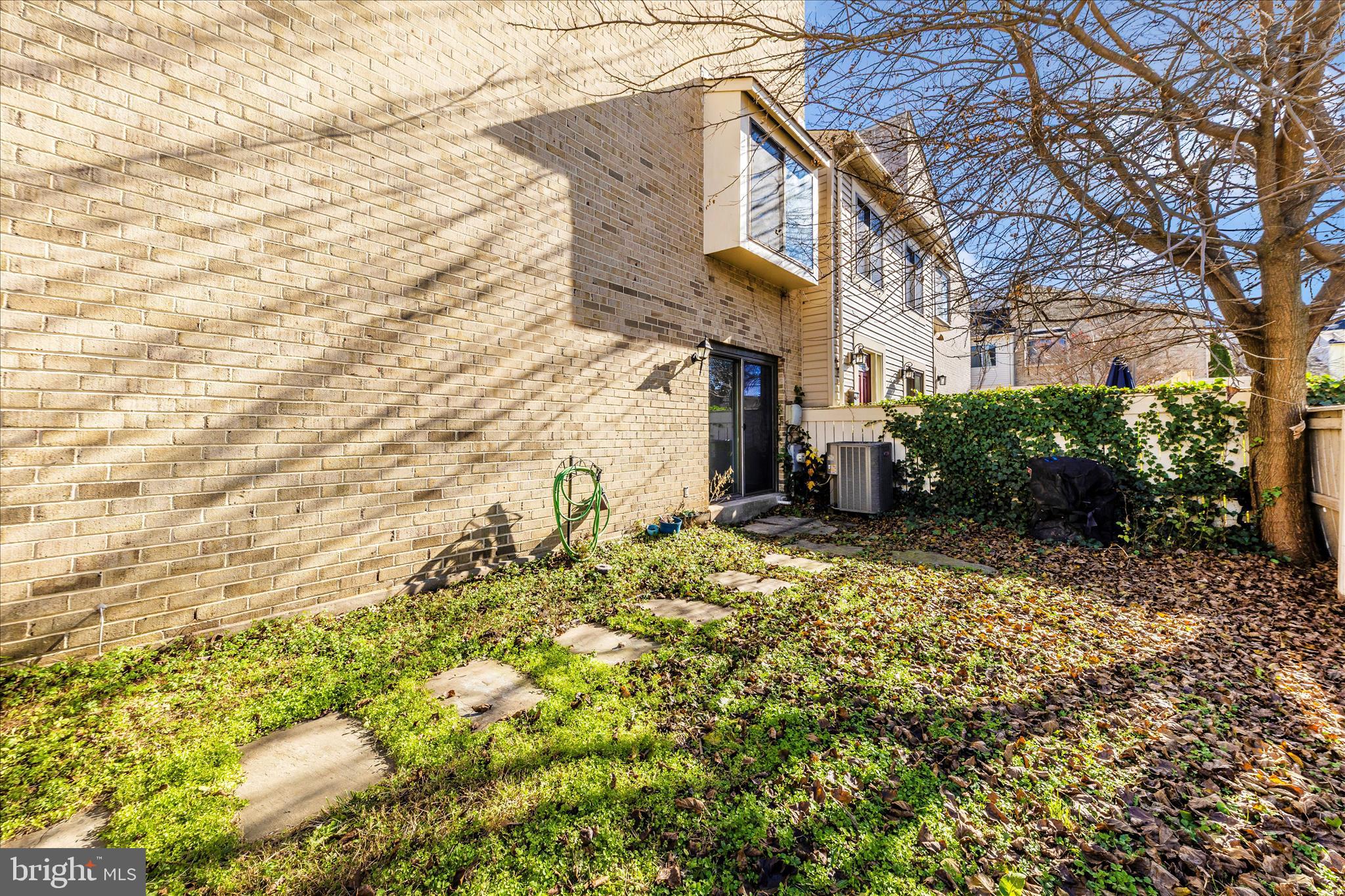 9989 Ridgeline Drive Montgomery Village, MD 20886 - Photo 25 of 26 a view of a street with plants and large trees