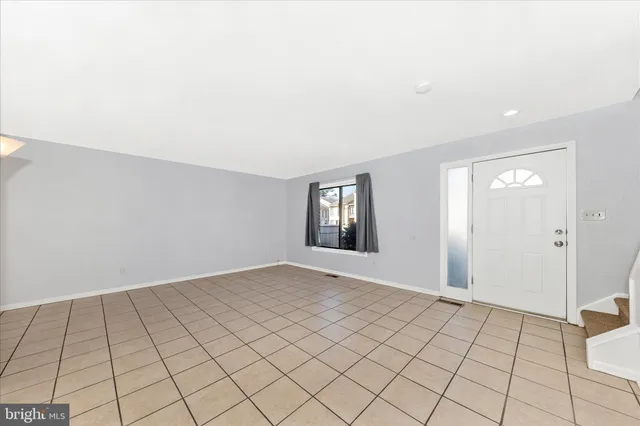 a view of an empty room and window