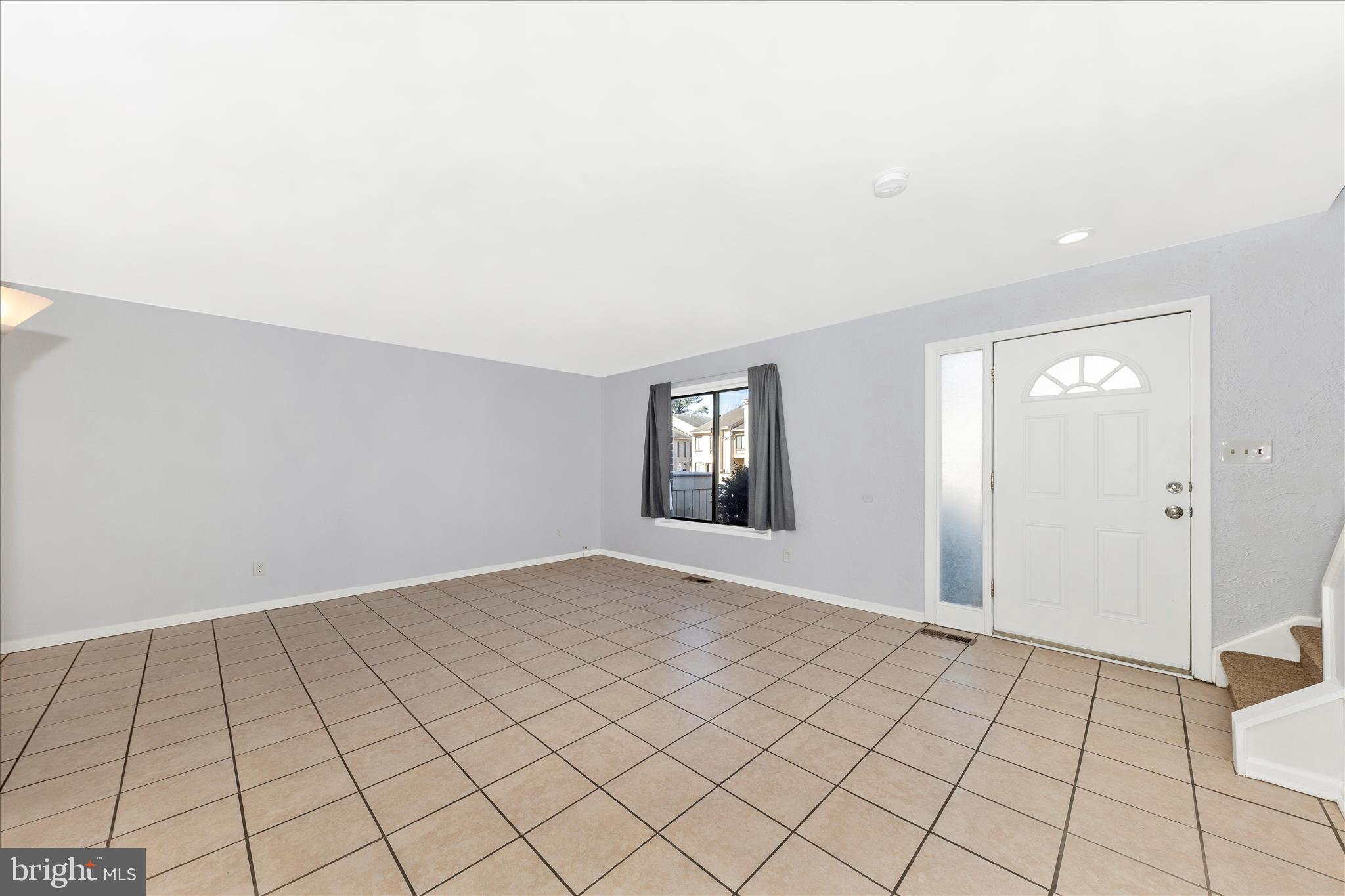 9989 Ridgeline Drive Montgomery Village, MD 20886 - Photo 5 of 26 a view of an empty room and window