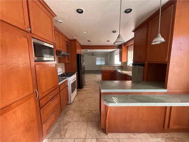 a view of kitchen with cabinets and wooden floor
