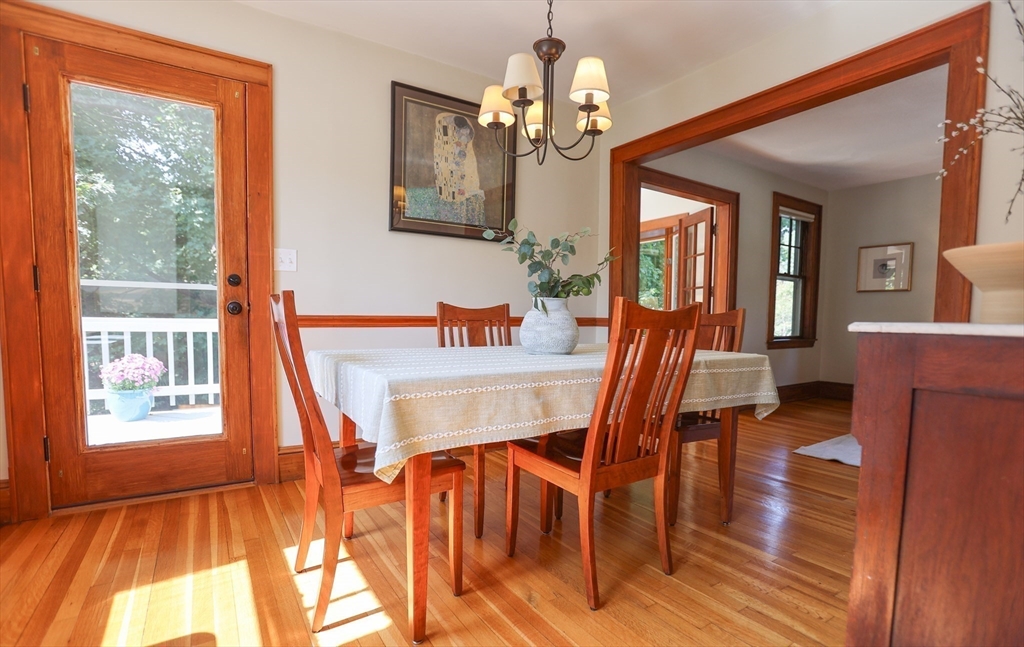 462 Marrett Road Lexington, MA 02421 - Photo 8 of 29 a dining room with furniture a chandelier and wooden floor