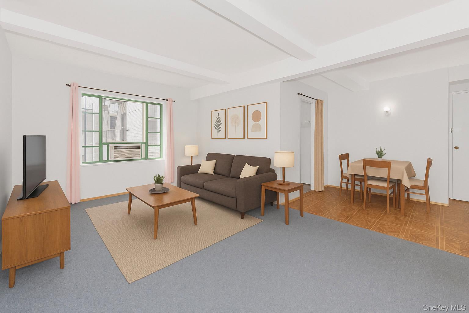 1540 Unionport Road, Unit 7F Bronx, NY 10462 - Photo 1 of 16 a living room with furniture and a flat screen tv with kitchen view