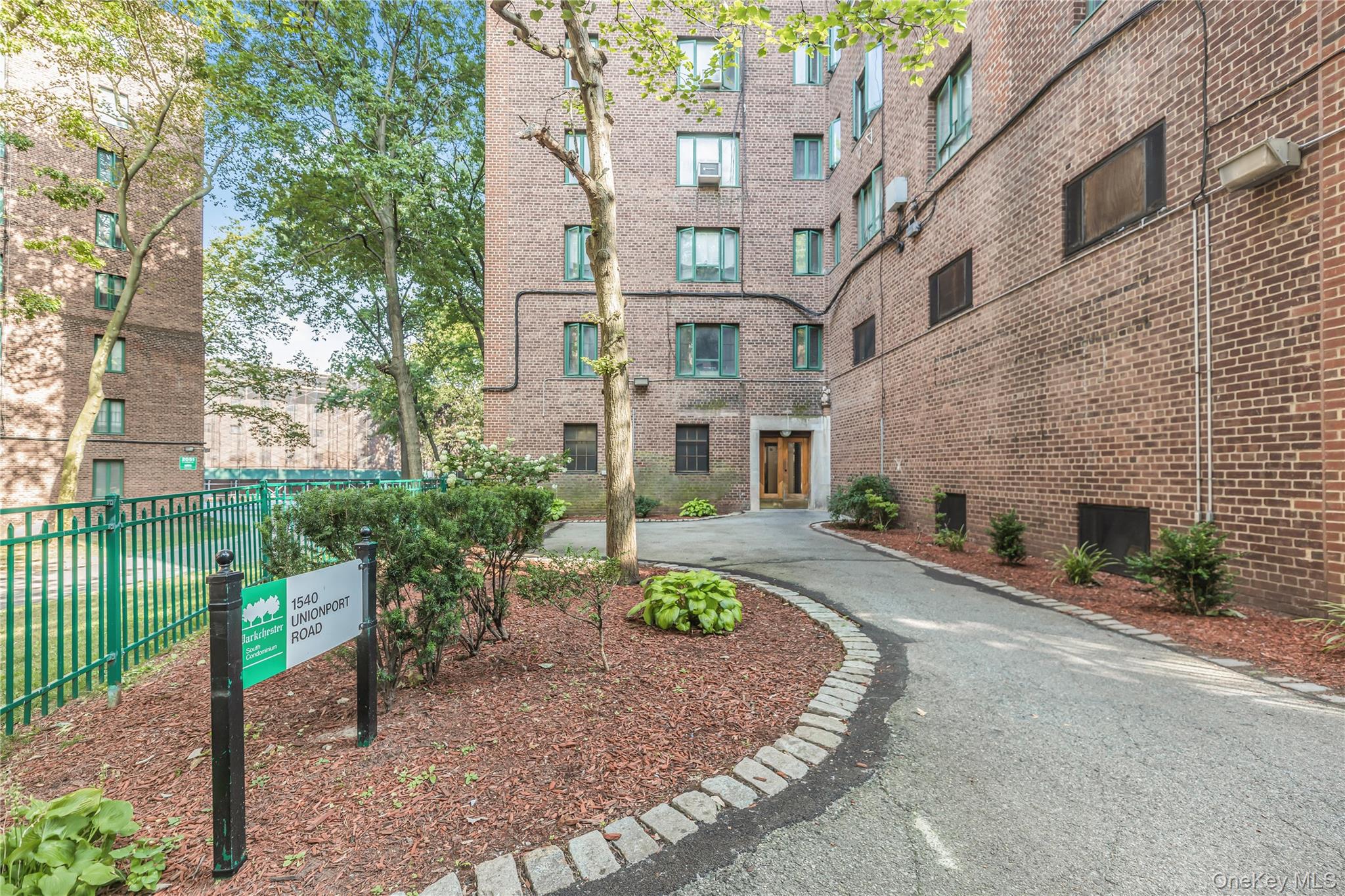 1540 Unionport Road, Unit 7F Bronx, NY 10462 - Photo 12 of 16 a front view of a building with garden